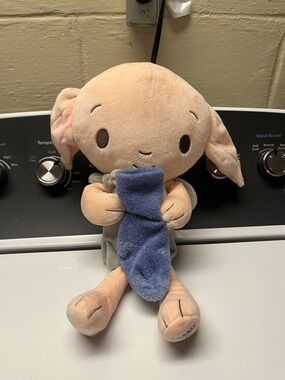 Dobby Holding Blue Sock